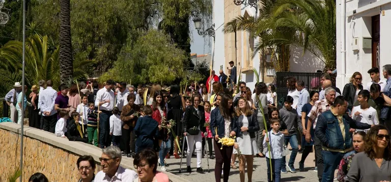 Procession during Holy Week in Moraira with participants in traditional attire