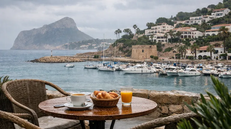 Rainy day atmosphere in Moraira with umbrellas and wet streets near the town center
